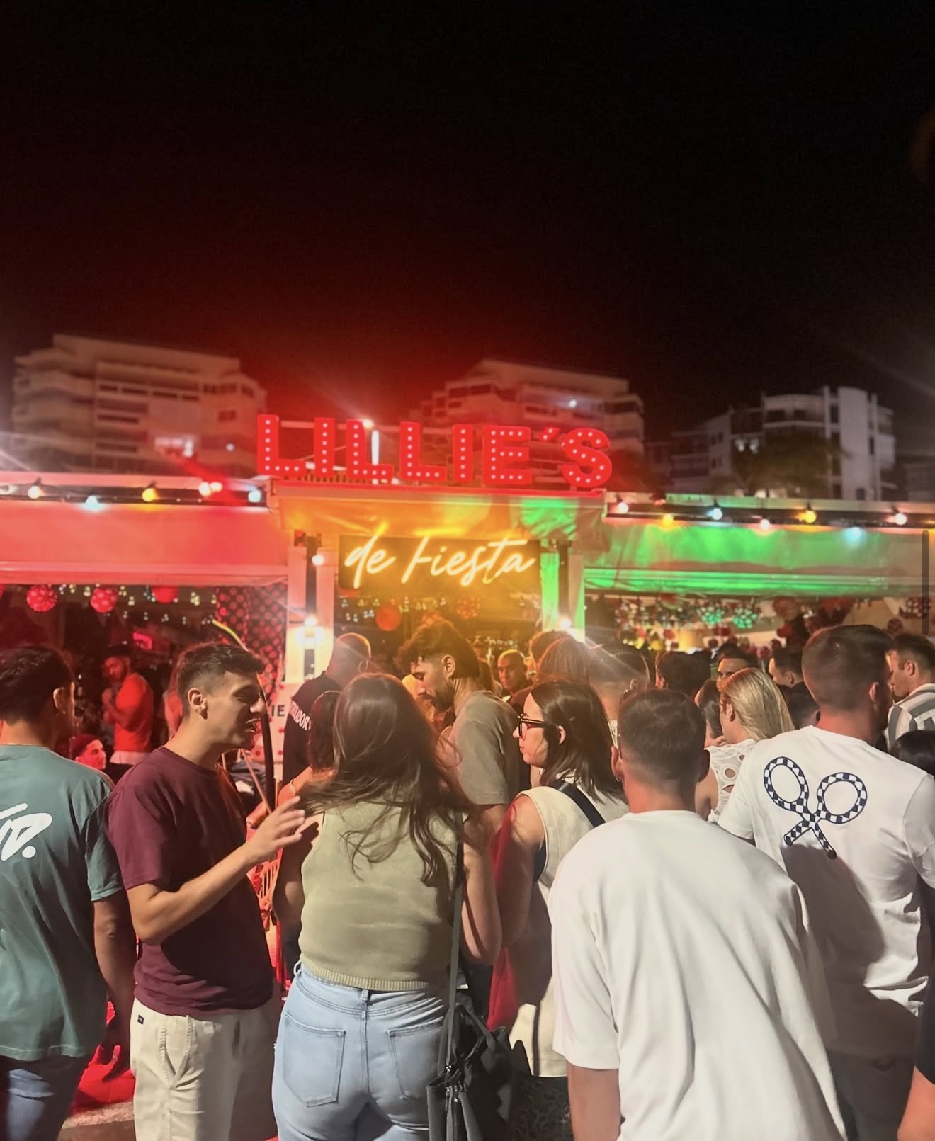 Packed crowd gathered outside Lillie's Marbella under the illuminated sign on a busy night